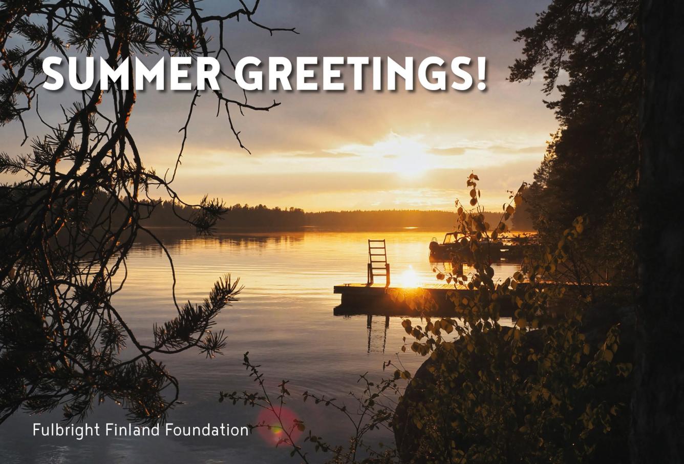 View of a lake during a sun set with text "Summer Greetings!" in the left corner