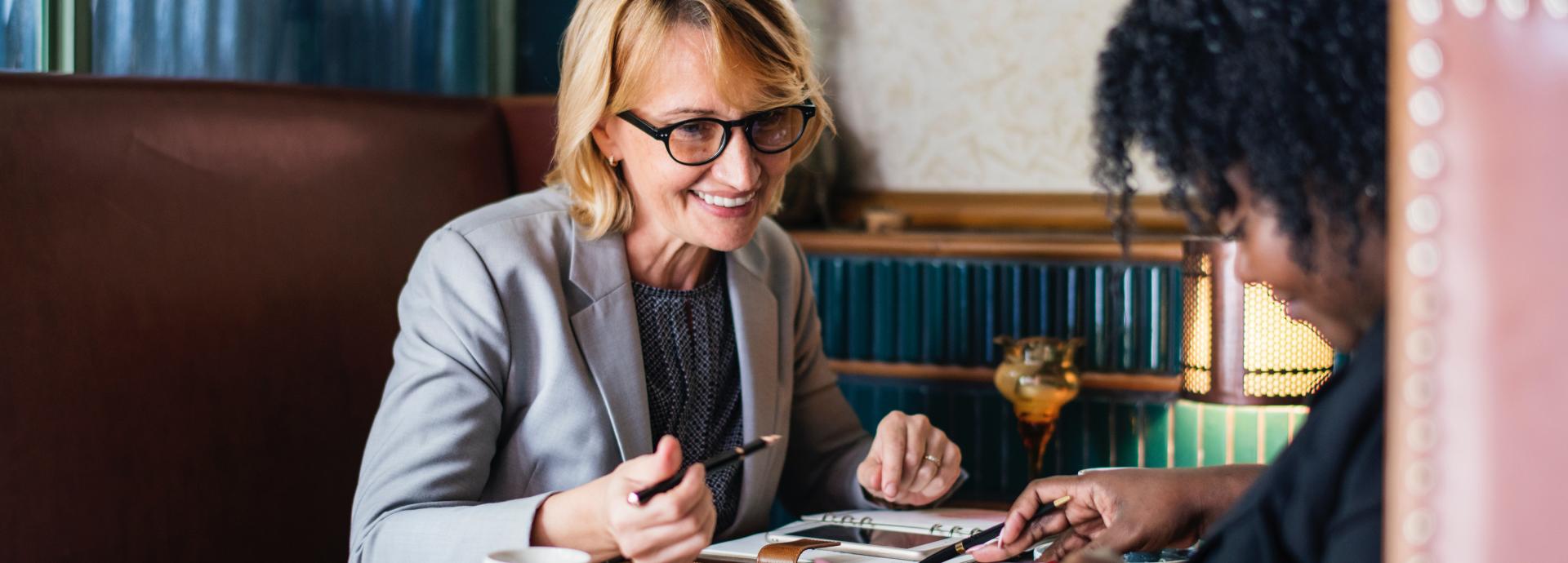 Two women working together.